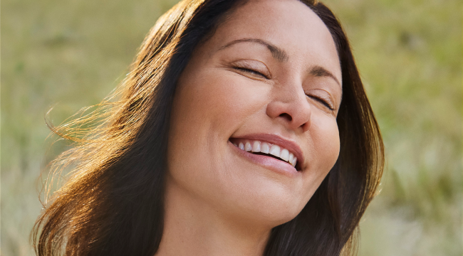 Woman showing her natural looking smile